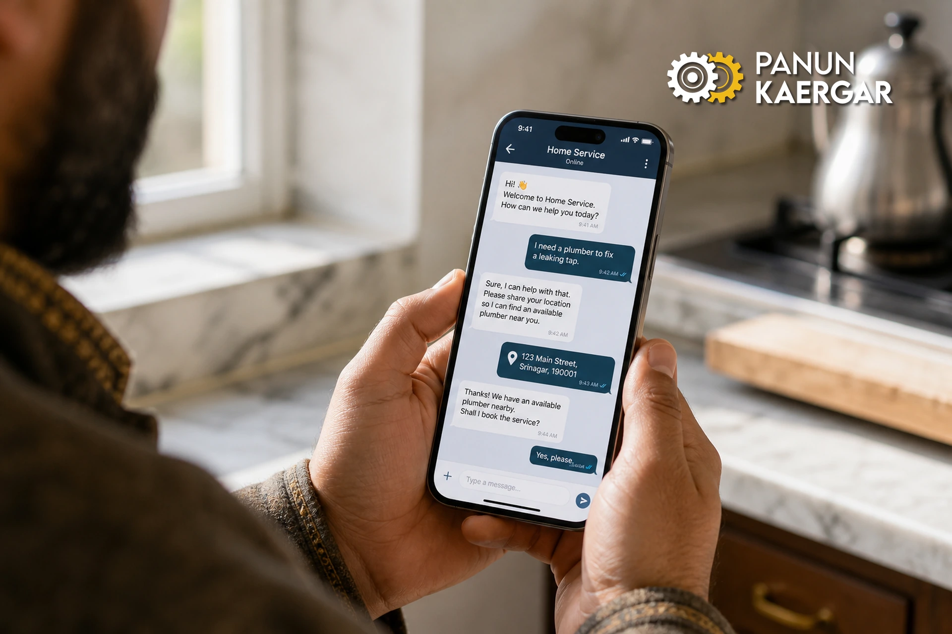 Close-up of Panun Kaergar app chat on a smartphone while booking home services in a Kashmir kitchen